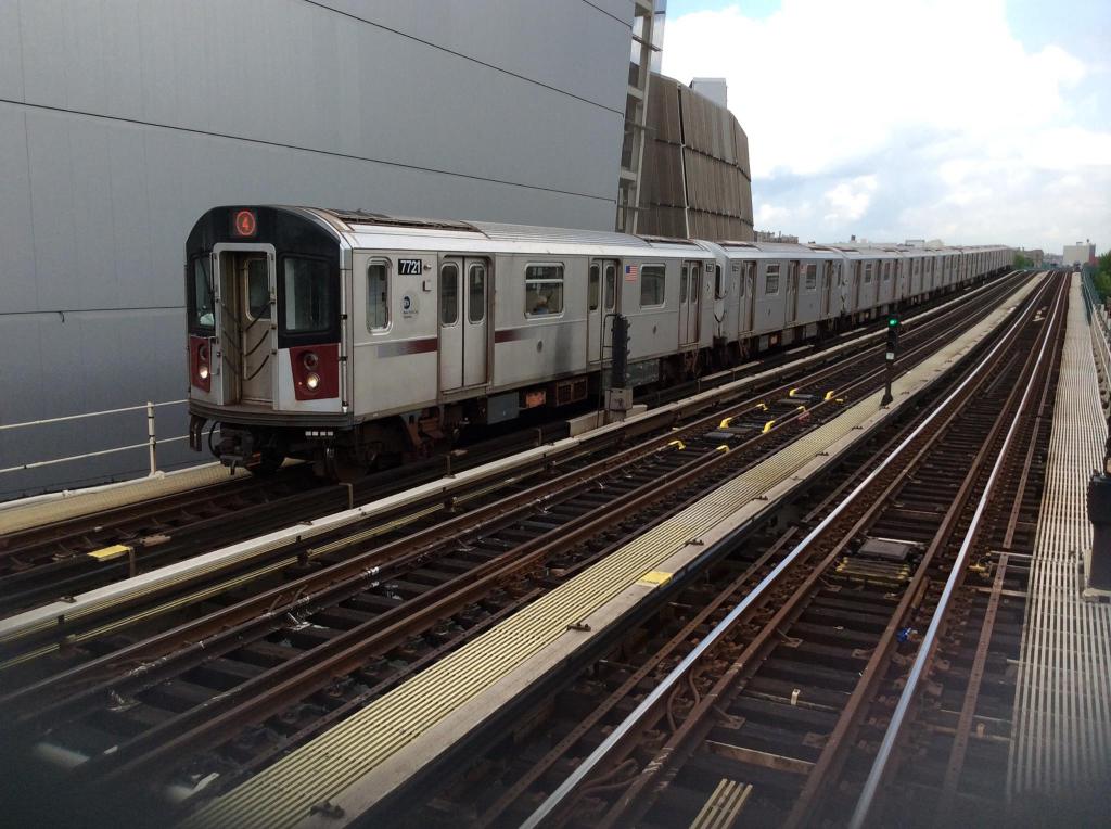 A Manhattan-bound 4 train pulling into the elevated 161st Street-Yankee Stadium station beside the stadium