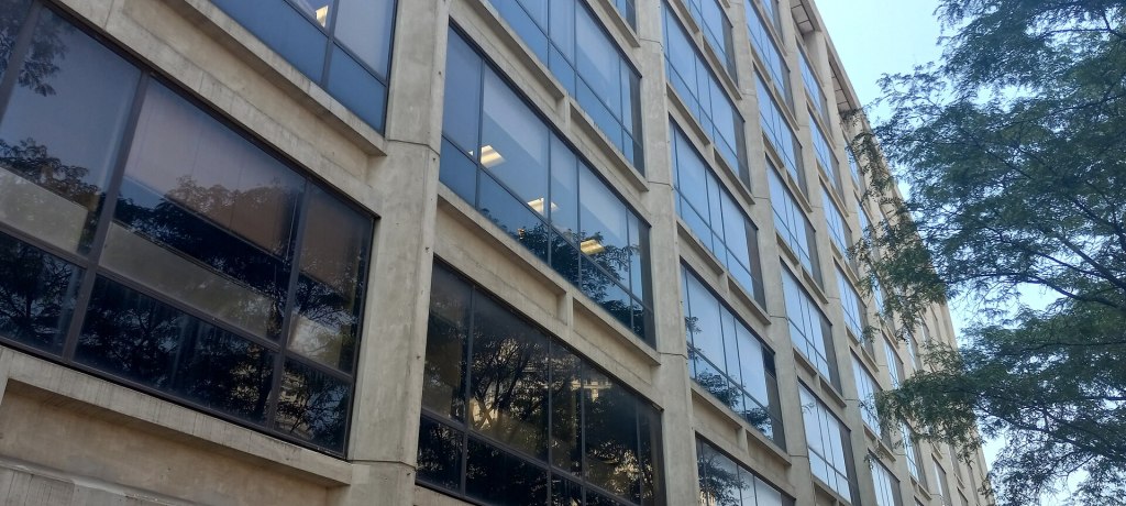 The concrete-and-glass Brutalist facade of 100 Gold Street, a city office building in Lower Manhattan