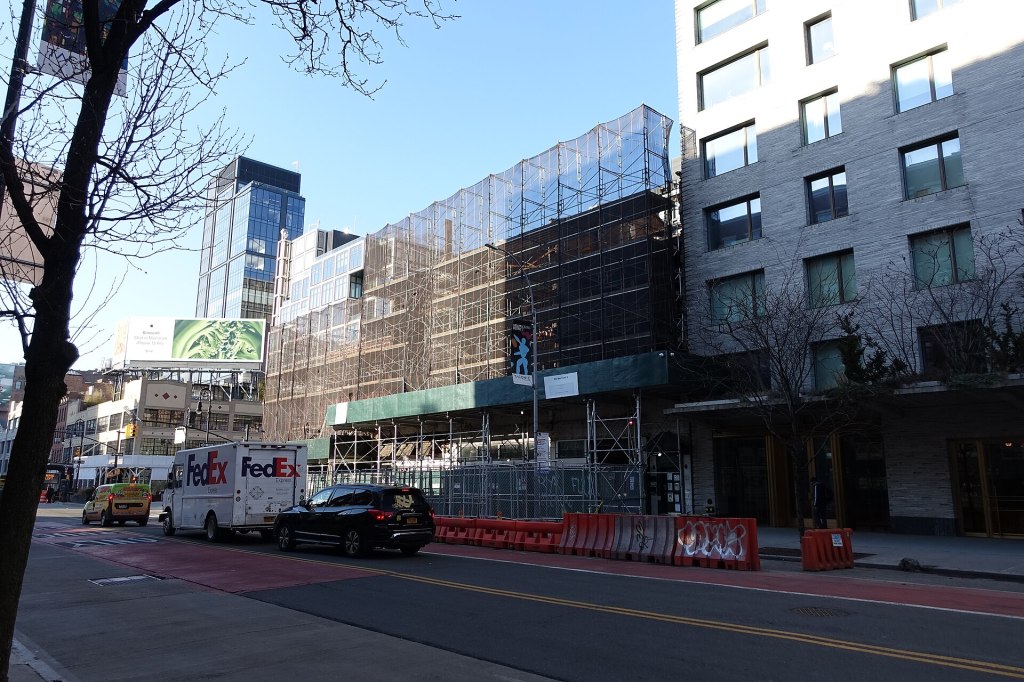 Scaffolding wraps 351-355 West 14th Street at Ninth Avenue in the Meatpacking District during its 2022 renovation