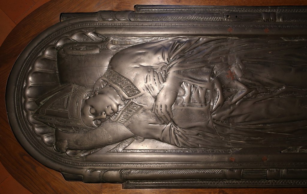 Donatello's bronze tomb slab of Bishop Giovanni di Bartolomeo Pecci, showing the bishop's effigy in relief