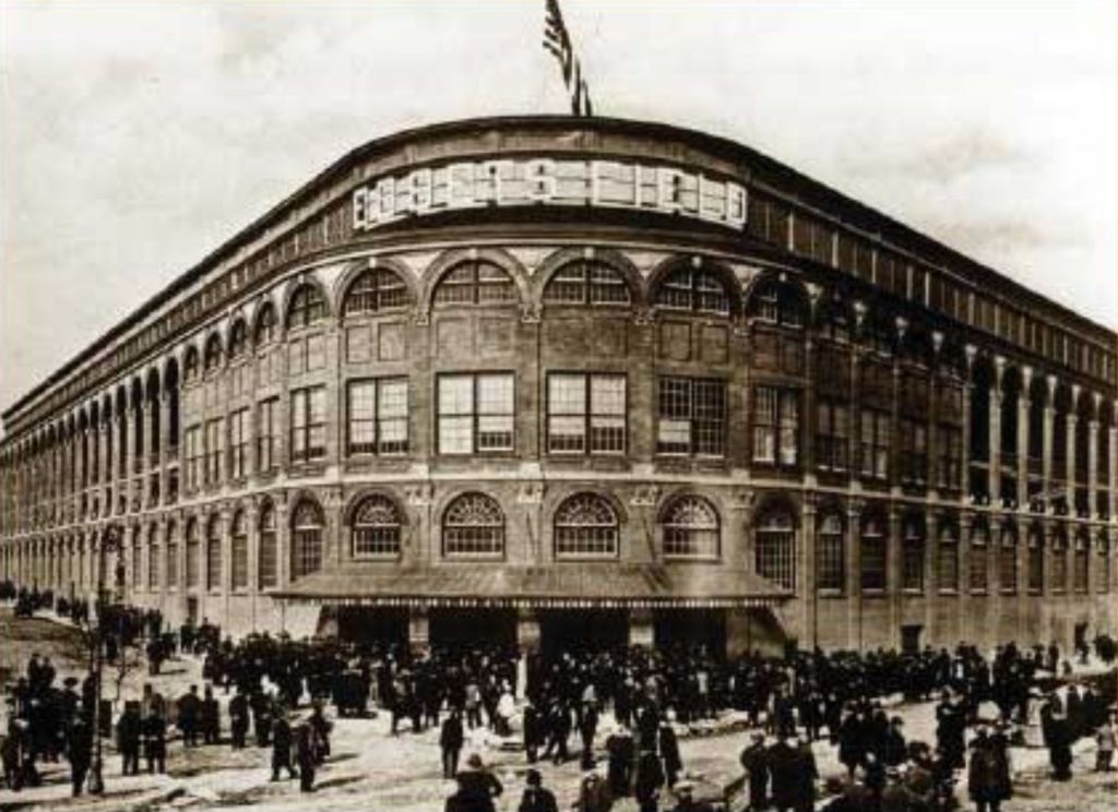 Crowds gather outside the arched brick rotunda of Ebbets Field in Brooklyn in 1913