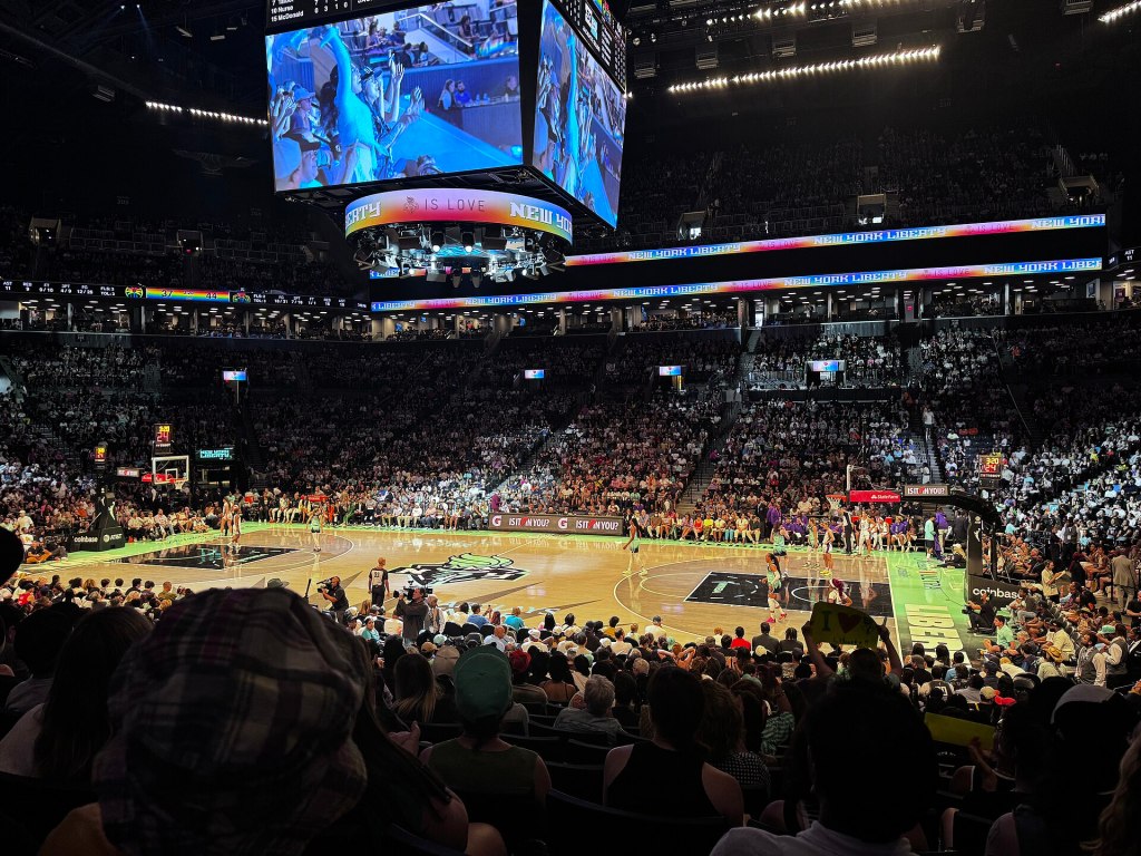 A packed Barclays Center during a New York Liberty game, seen from the upper seats