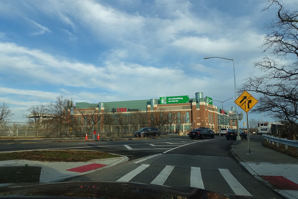 The brick facade of UBS Arena at Belmont Park in Elmont, seen from a roadway
